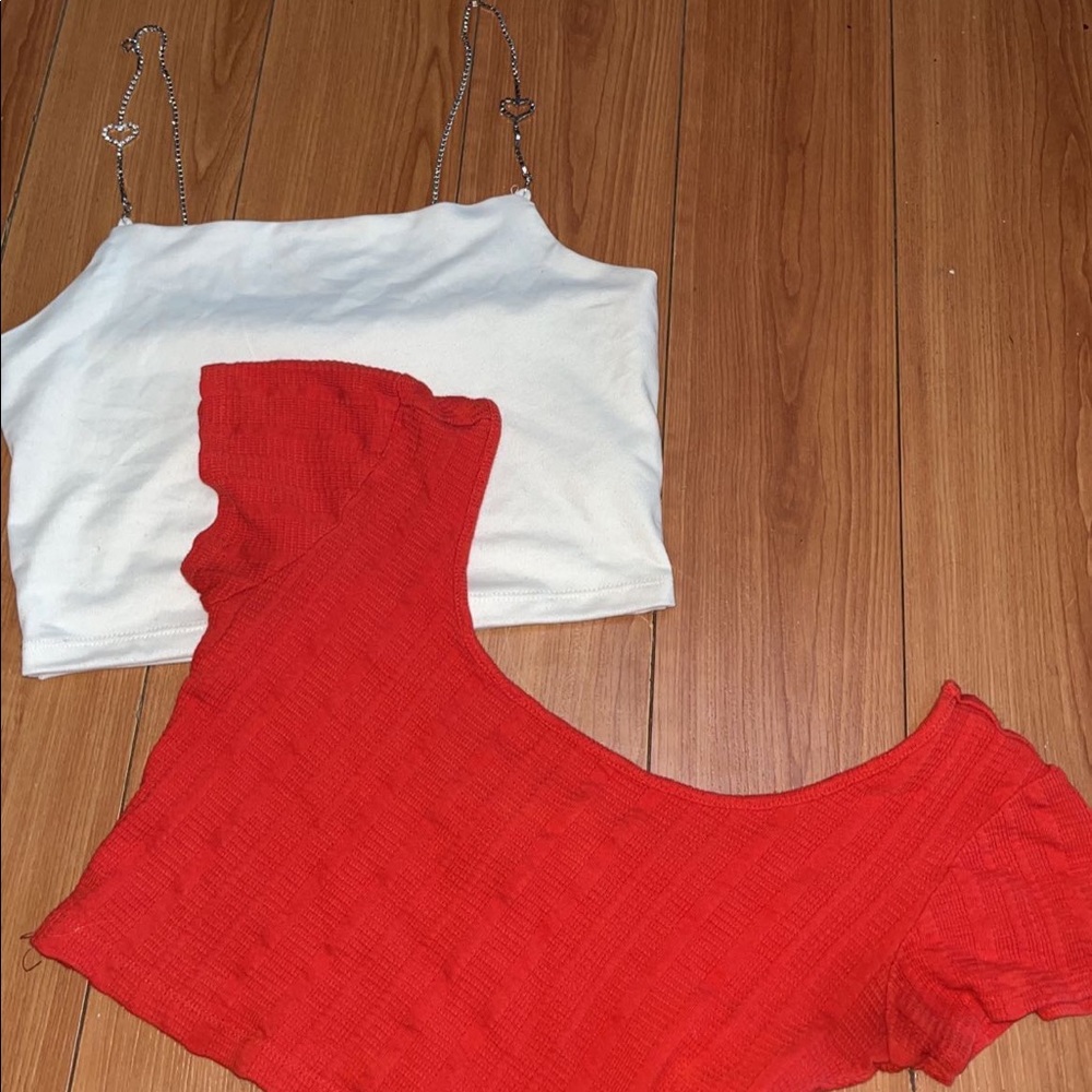 White heart rhinestone top, red cropped shirt with open back.